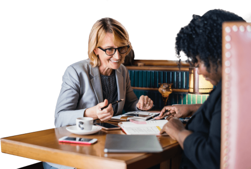 Two Female Professionals In A Business Meeting Job